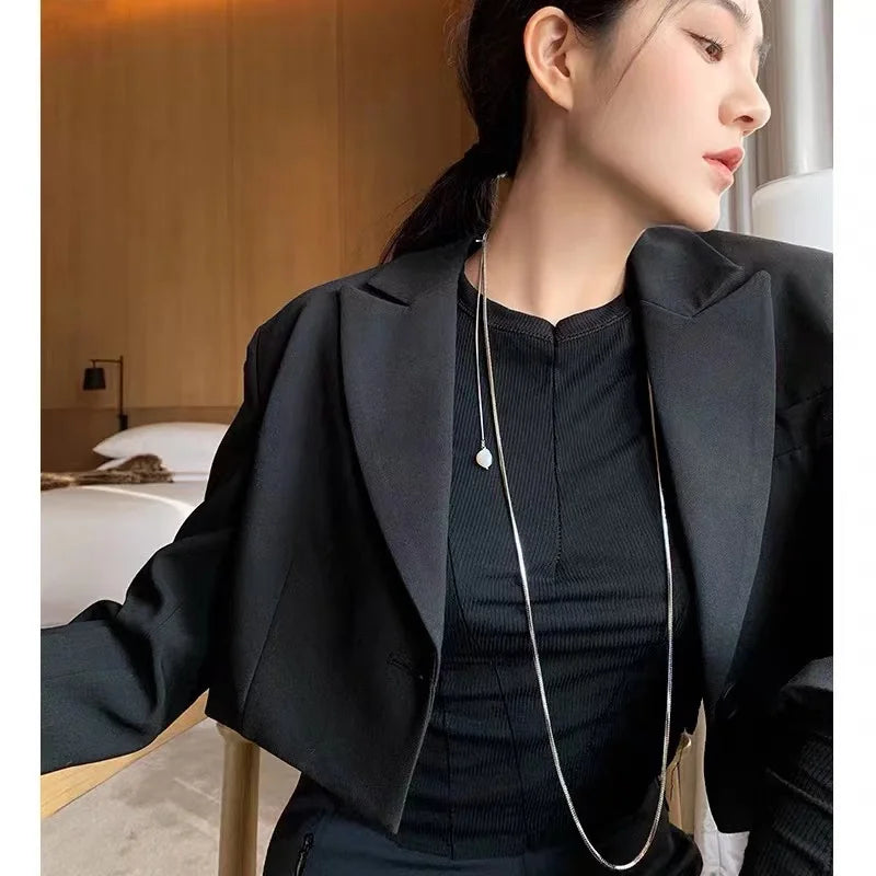 Niche design fold wear simple long snake bone chain light luxury freshwater pearl necklace senior sense sweater chain female